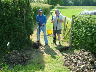 Malcolm and Allan digging the post holes for a new gate